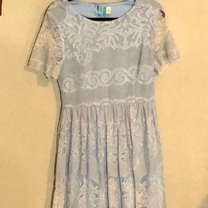 Just above the knee blue and white dress